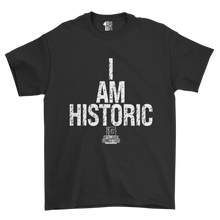 Load image into Gallery viewer, Black t-shirt with 'I AM HISTORIC' text and logo on a white background
